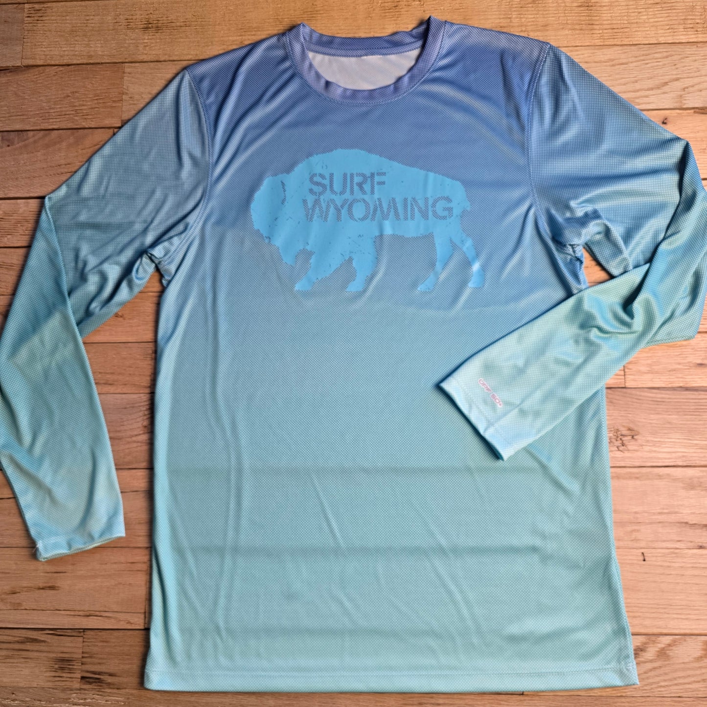 Unisex Surf Wyoming®Original LS Performance tee- upf50- bluemist